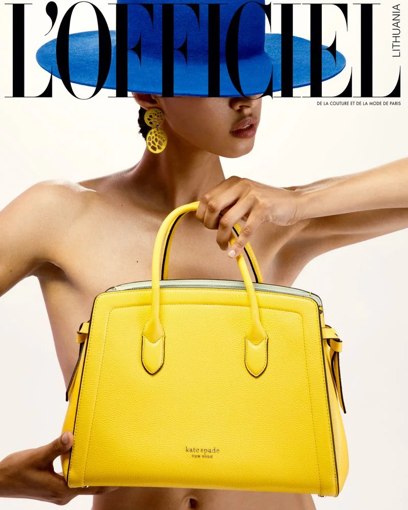 L’Officiel Lithuania page with a blue hat and a bright yellow handbag.